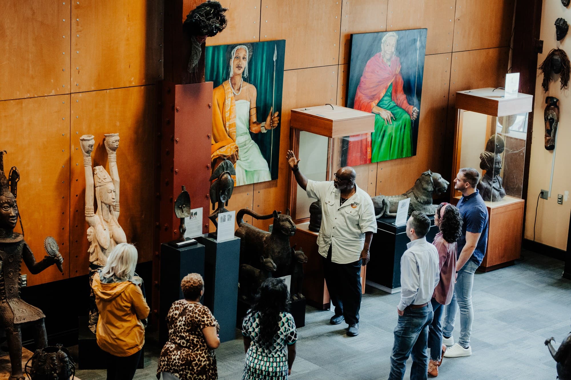 Visitors exploring exhibits inside Roots 101 African American Museum