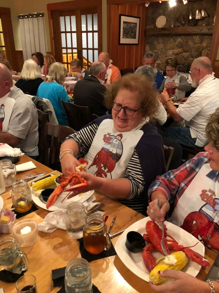 Great Falls Travel guests enjoying a New England lobster dinner